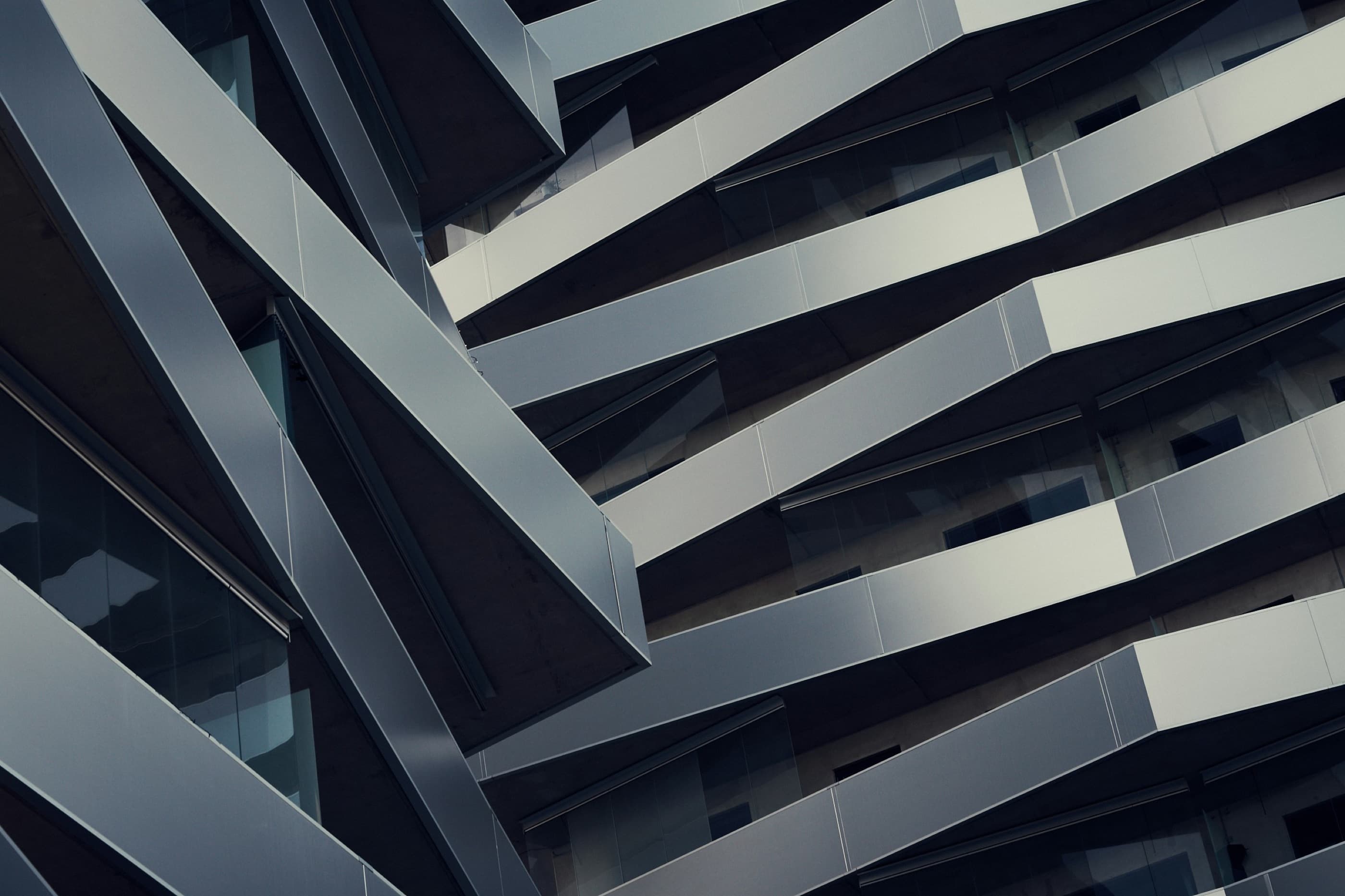 Detail of metal and glass on a dark façade